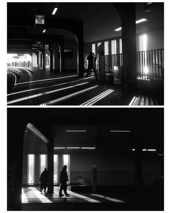 Two black and white images show people in a subway station with strong shadows and light.