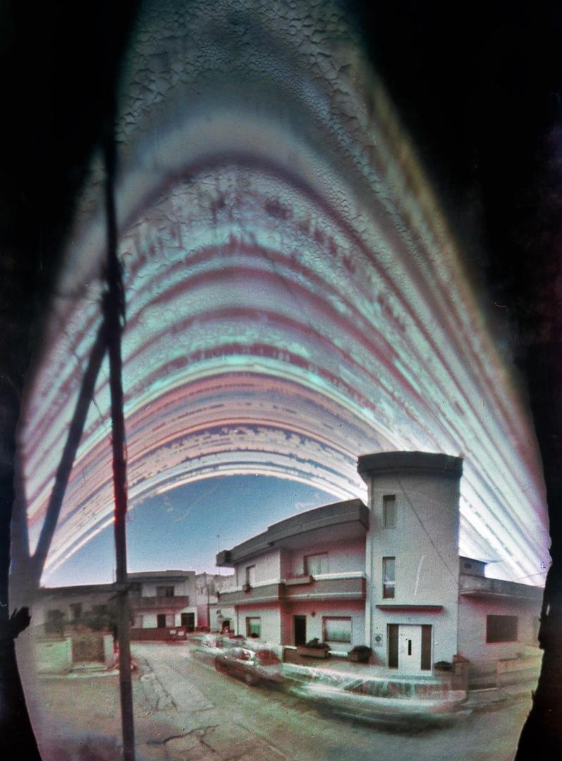 7 months of exposure, with a homemade pinhole camera made from PVC pipes, placed in my house in southern Italy [Homemade Pinhole Camera, Kodak Photo Paper], tagged sky