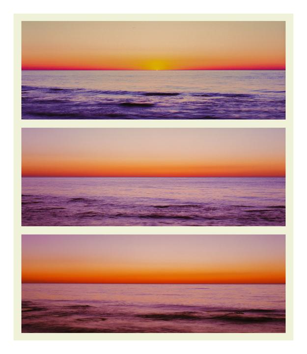 Three long exposure photographs of a sunset over the sea are arranged in a triptych.
