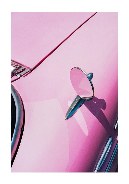 A pink car with a side mirror is shown in a close-up shot.