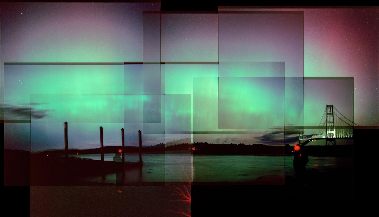 A collage of multiple exposures shows the northern lights over a body of water with a bridge and a person.