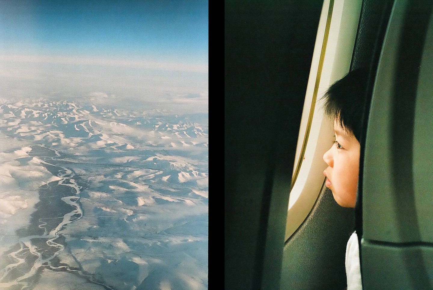 A child looks out an airplane window at a snowy, mountainous landscape with a winding river below.