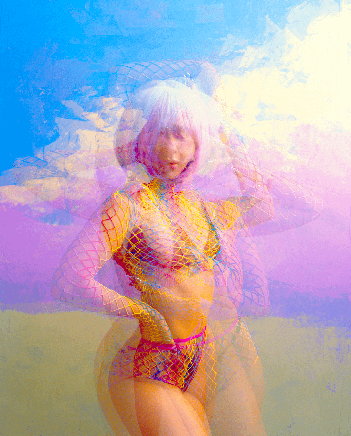 A woman with pink hair and a fishnet top poses against a colorful background.