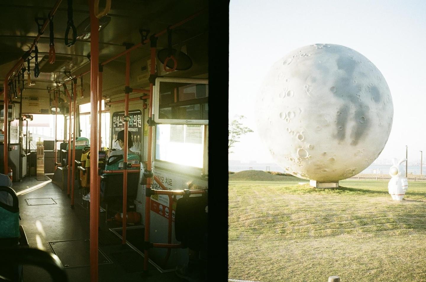 A split image shows the interior of a bus on the left and a large moon sculpture in a grassy field on the right.