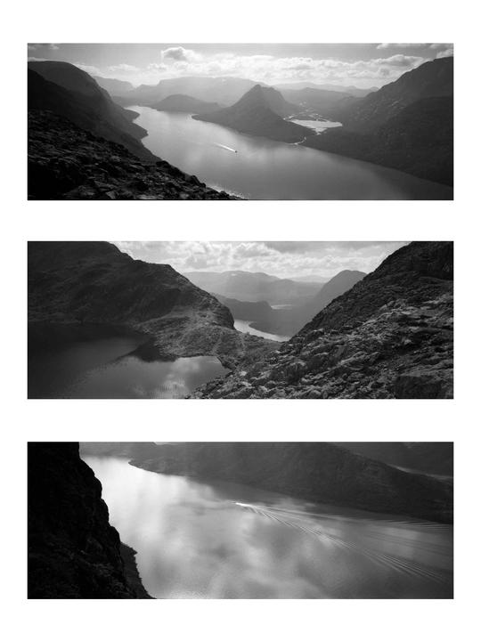Three black and white landscape photographs show a boat on a body of water surrounded by mountains.