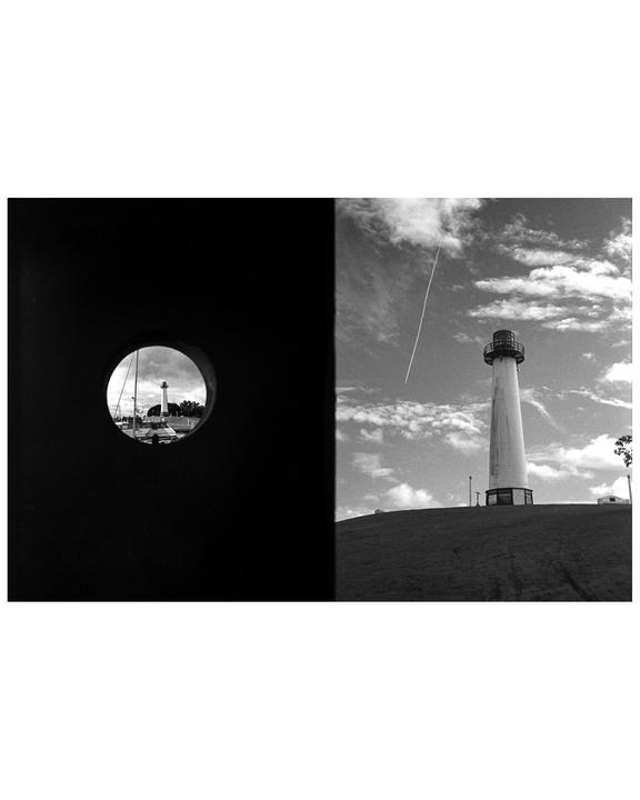 A lighthouse is visible through a circular opening on the left and on a grassy hill under a cloudy sky on the right.