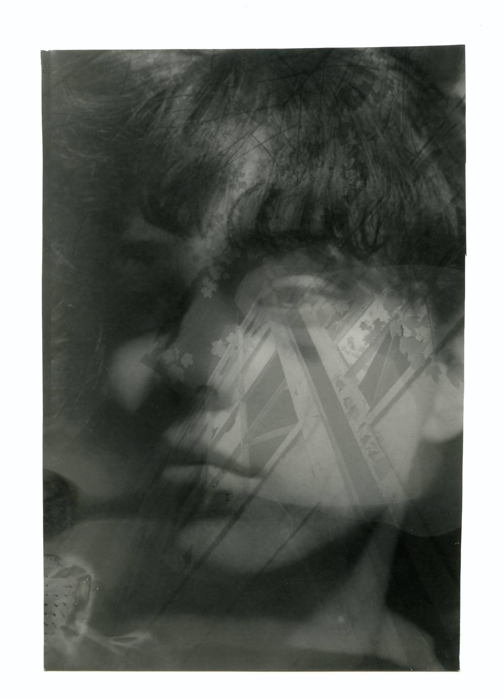 A double exposure shows a woman's face overlaid with a building facade and foliage.
