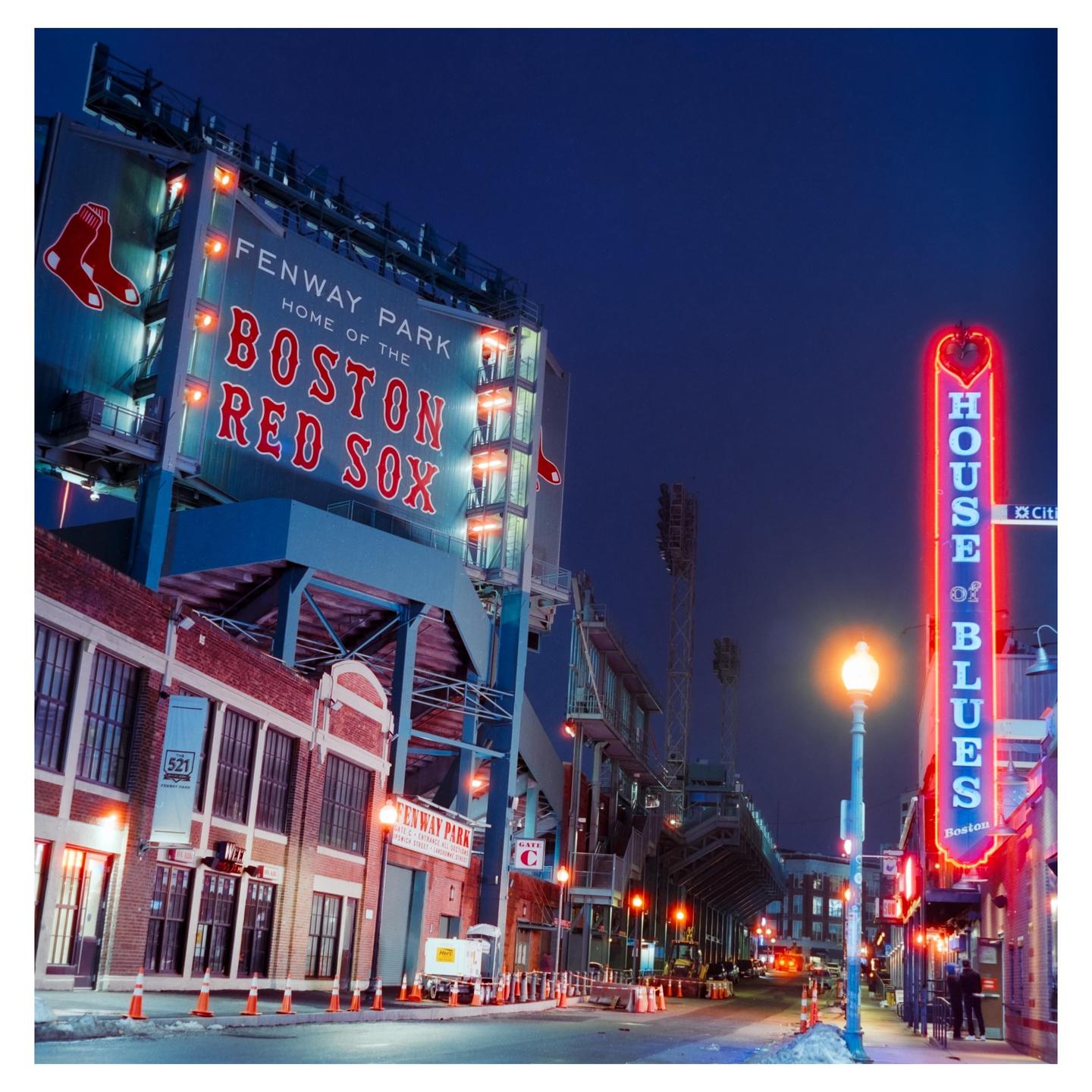 Fenway Park and the House of Blues are illuminated at night.