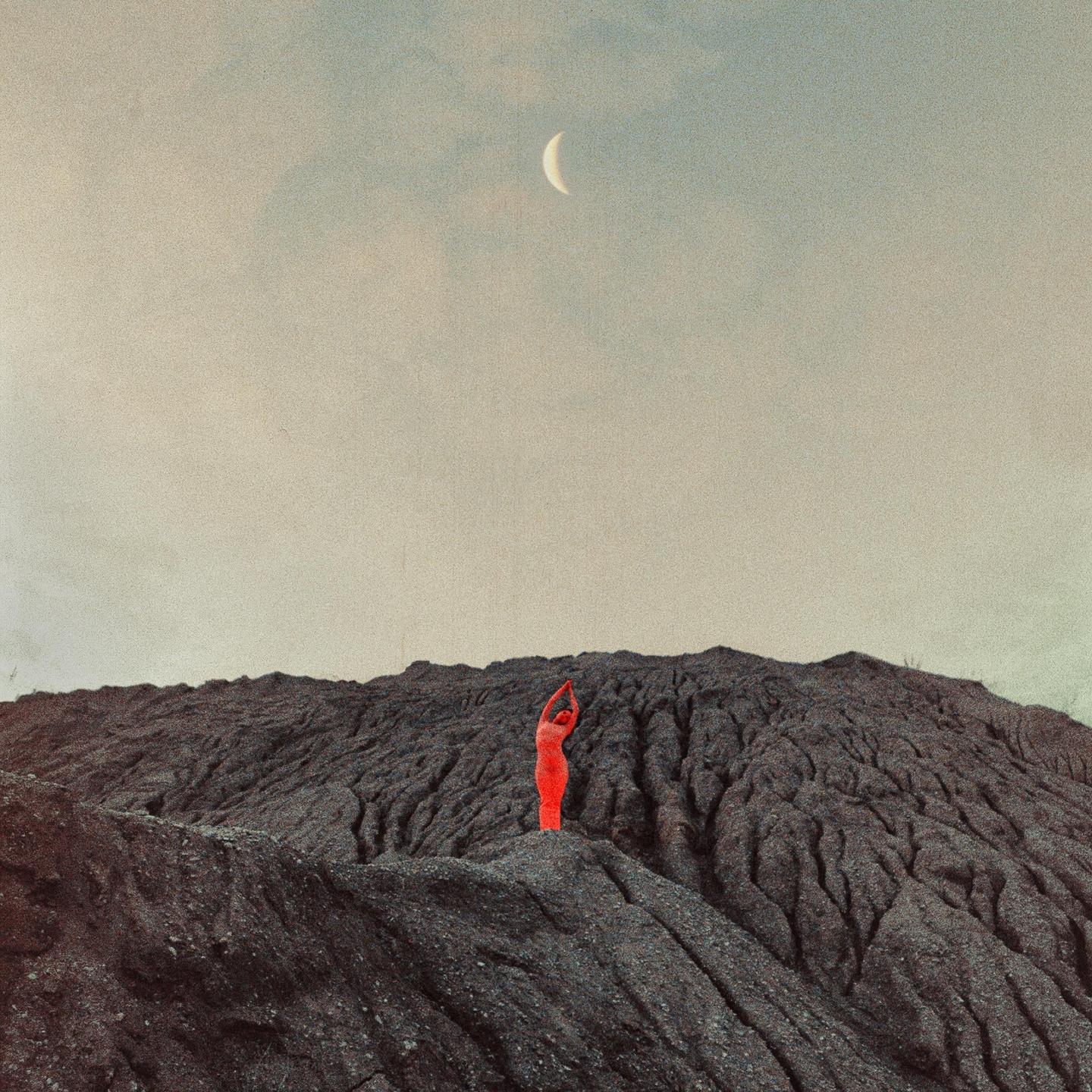 A person in a red suit stands on a dark, textured hill under a cloudy sky with a crescent moon.