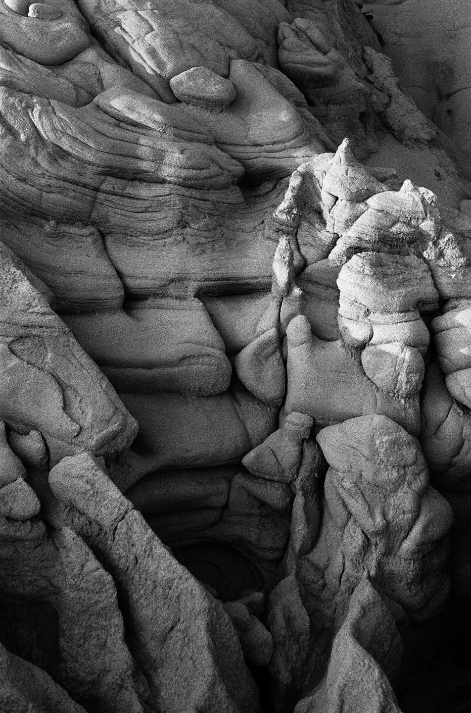 A close-up, high-angle shot shows a collection of rocks with varied textures and shapes.