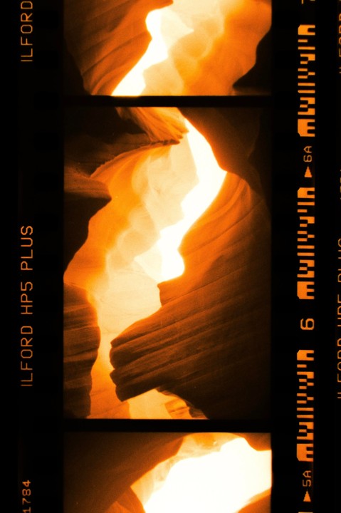 Light illuminates the textured walls of a slot canyon.