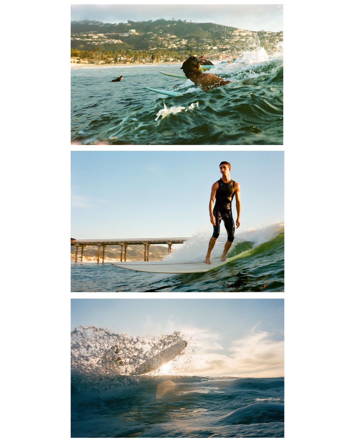 A man in a wetsuit surfs a wave near a pier at sunset, with a dog paddling in the water in the distance.
