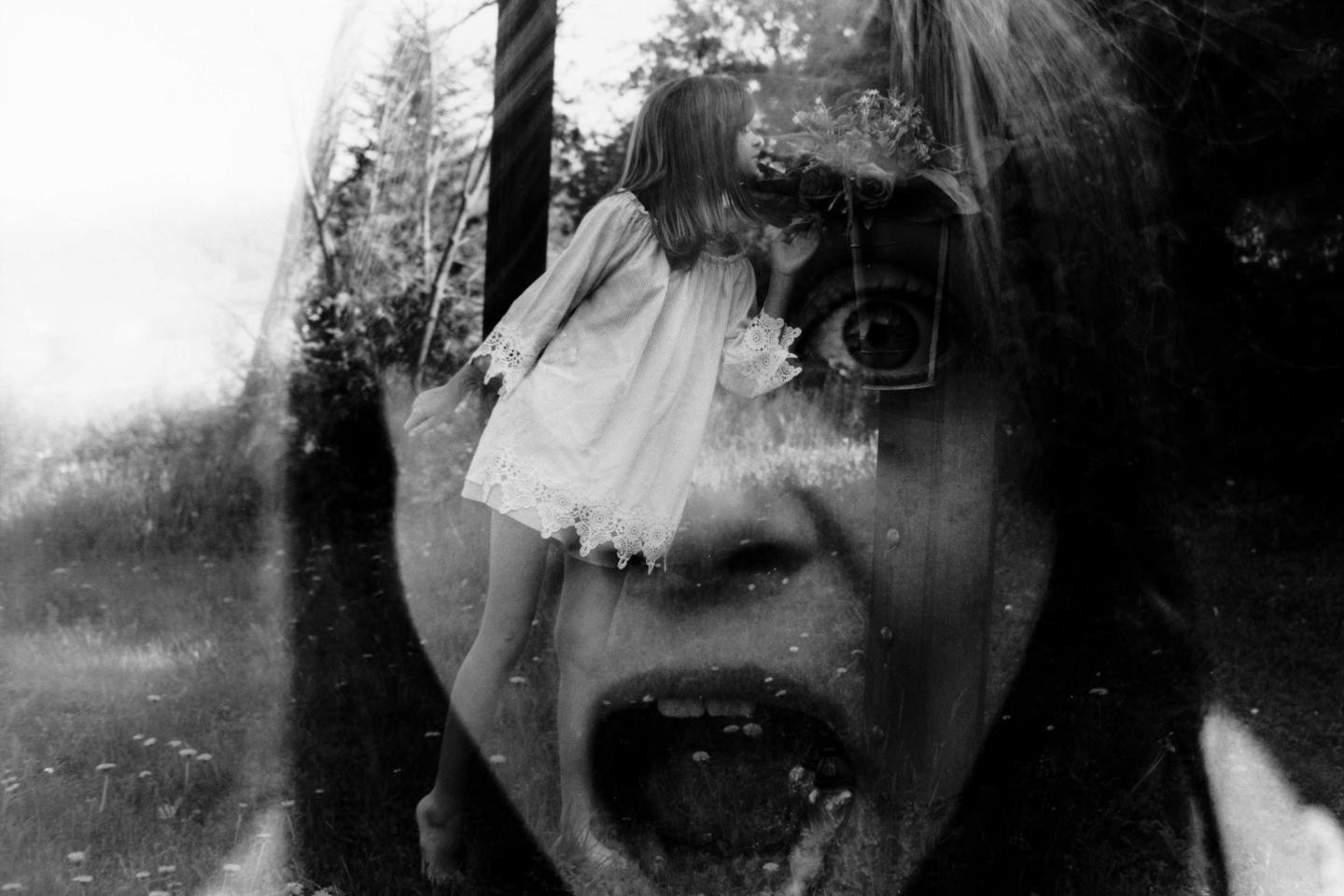 A double exposure shows a girl in a white dress superimposed over a screaming face with a large eye.