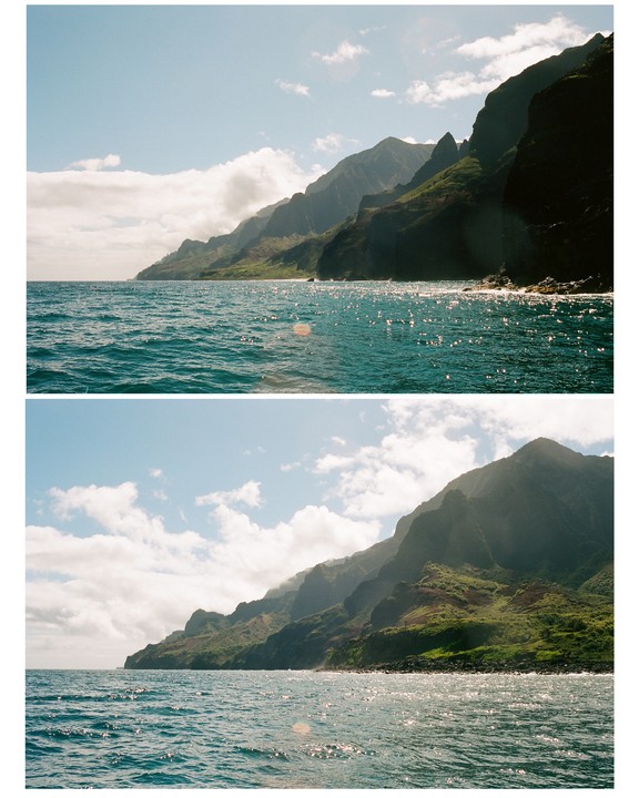 The Nā Pali Coast is visible from the ocean under a partly cloudy sky.