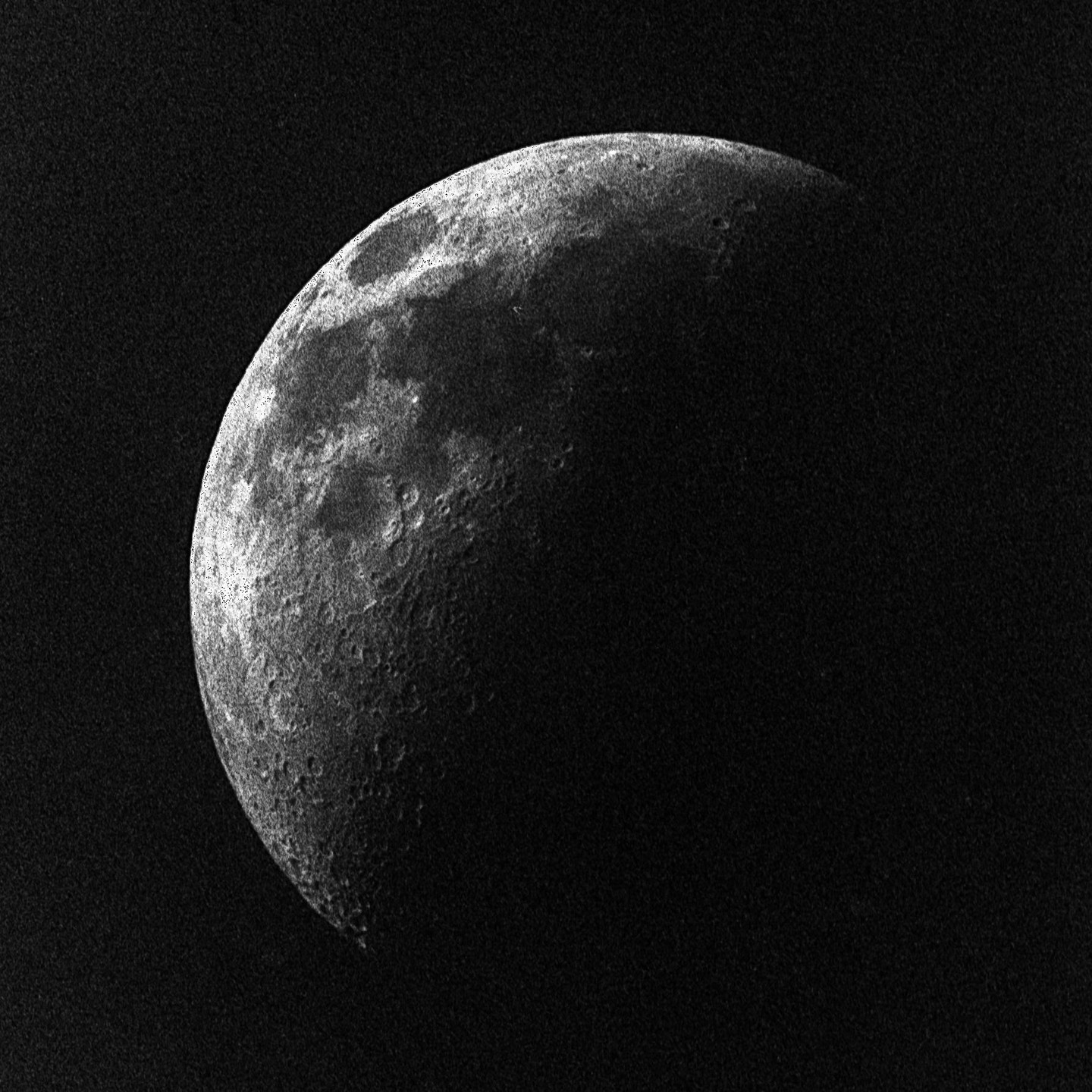 The moon is visible in the night sky, showing its craters and texture.