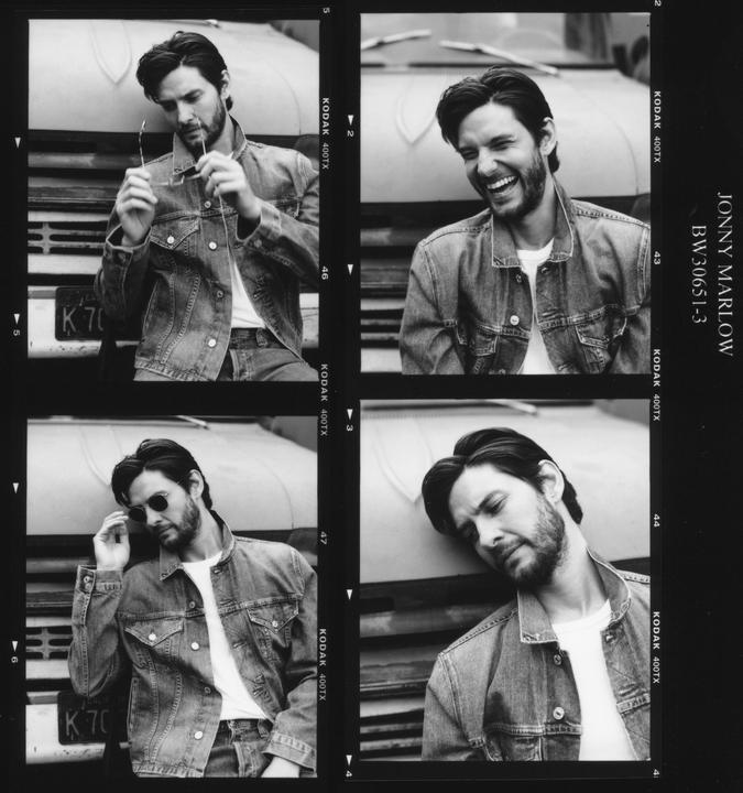 A man in a denim jacket poses in four frames, leaning against a vehicle.