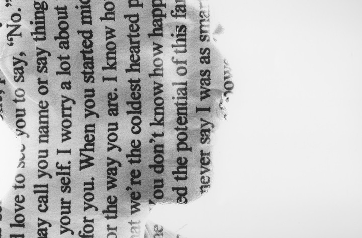 A torn piece of paper with text is shown against a white background.