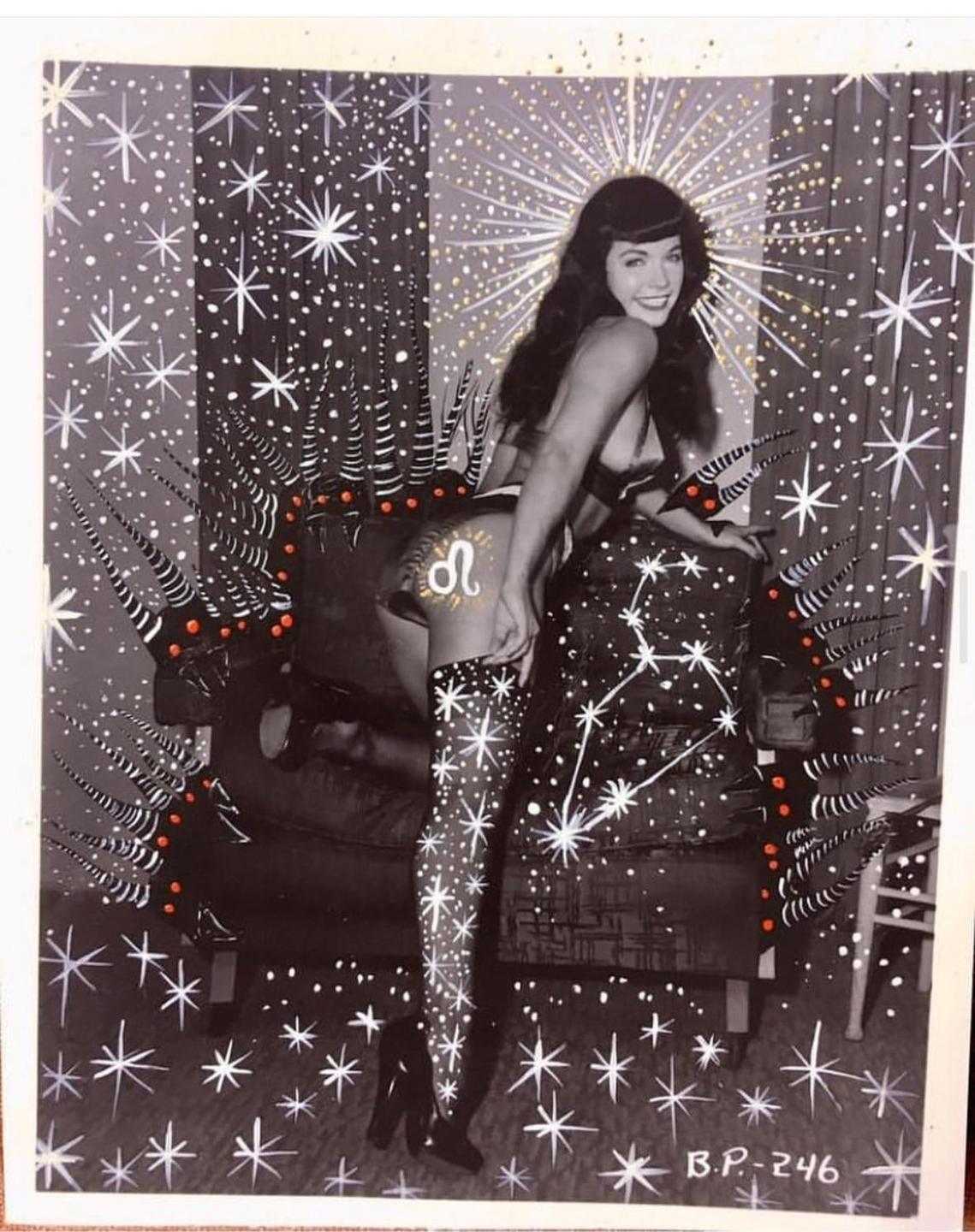 A woman in lingerie poses in front of a starry background with a Leo zodiac sign on her hip.