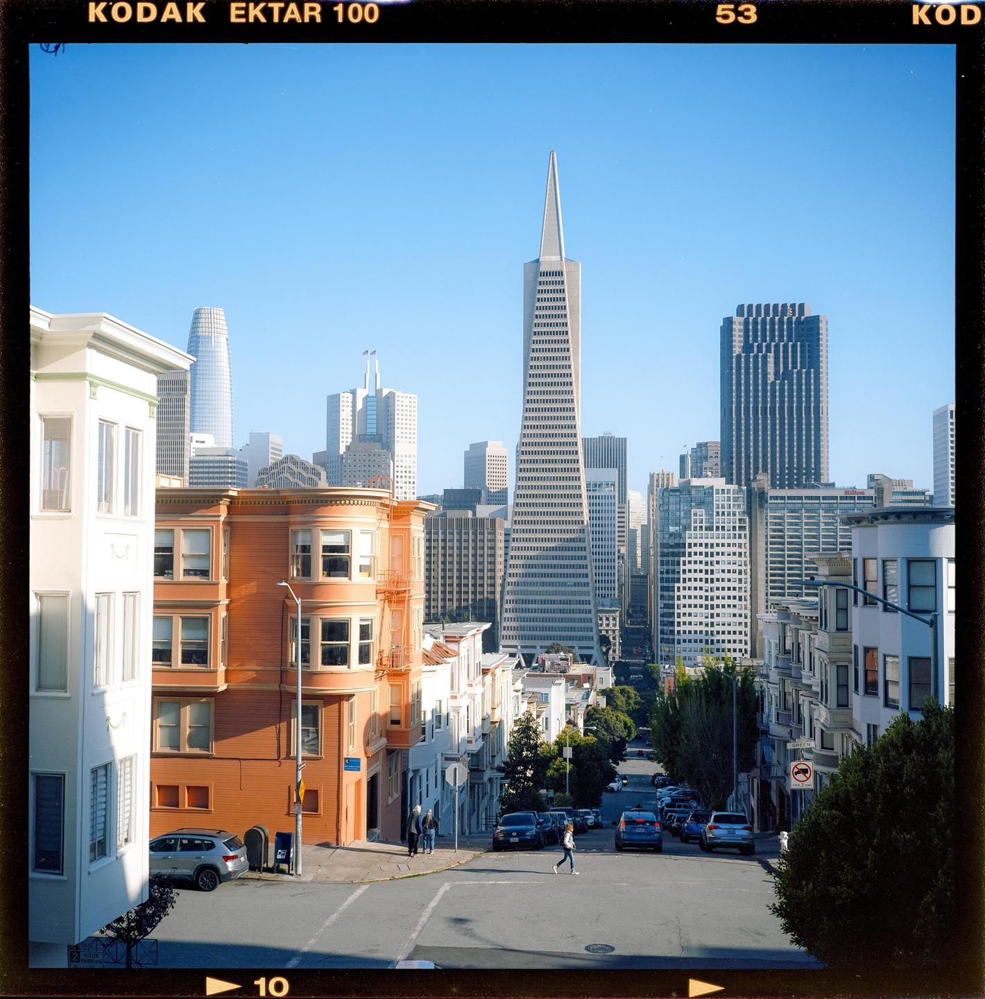 A street in San Francisco with the Transamerica Pyramid in the background.