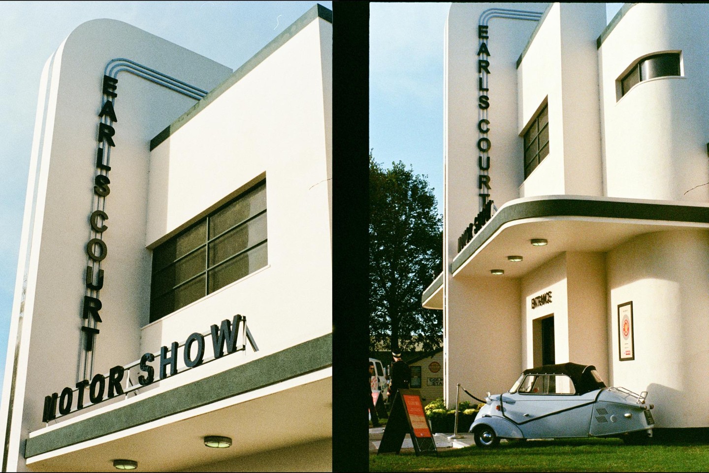 A small, light blue car is parked in front of a white building with "Earls Court Motor Show" written on it.