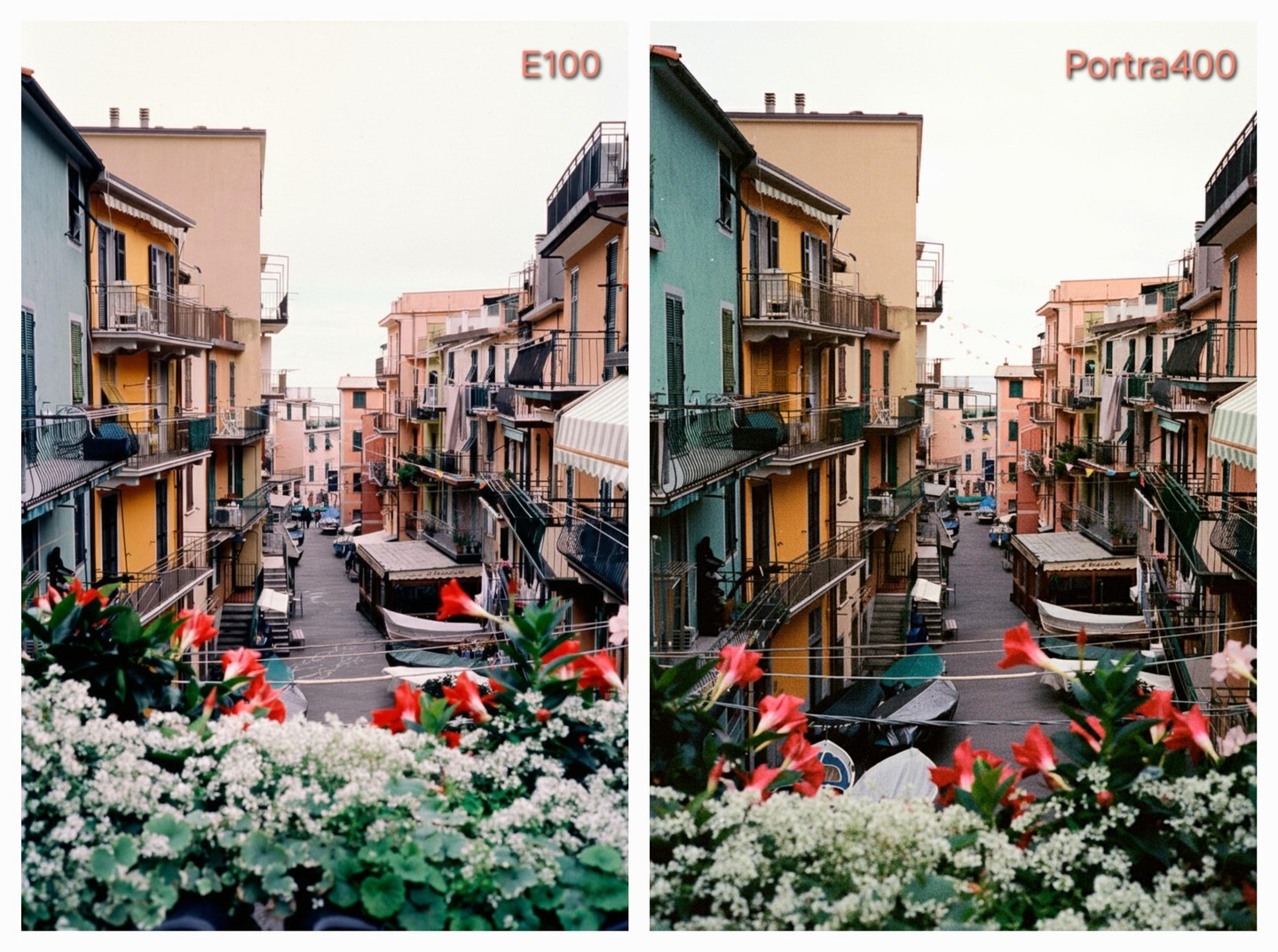 A narrow street in an Italian village is lined with colorful buildings and boats, viewed from behind a balcony with red and white flowers.