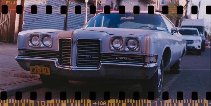 A vintage Pontiac Catalina is parked on a street in New York.