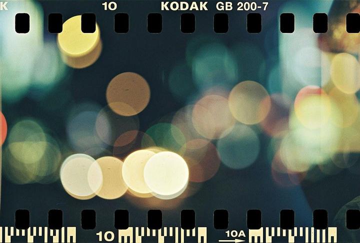 A dark image shows many out-of-focus circular lights in various colors.