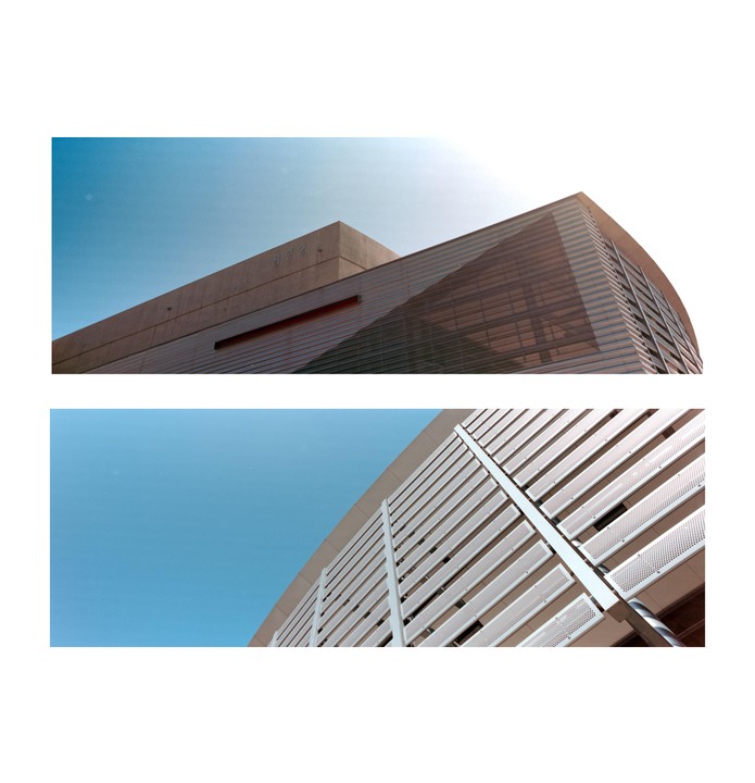 Two architectural studies show the upper parts of two different buildings against a clear blue sky.