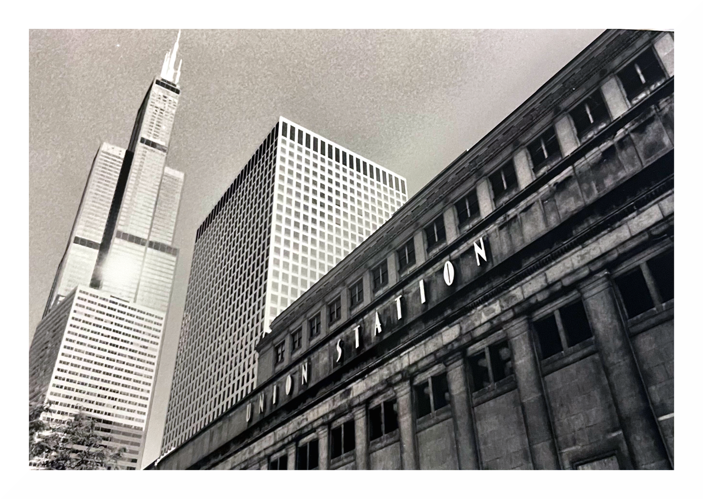 Three buildings, one with "Union Station" written on it, are seen from a low angle.