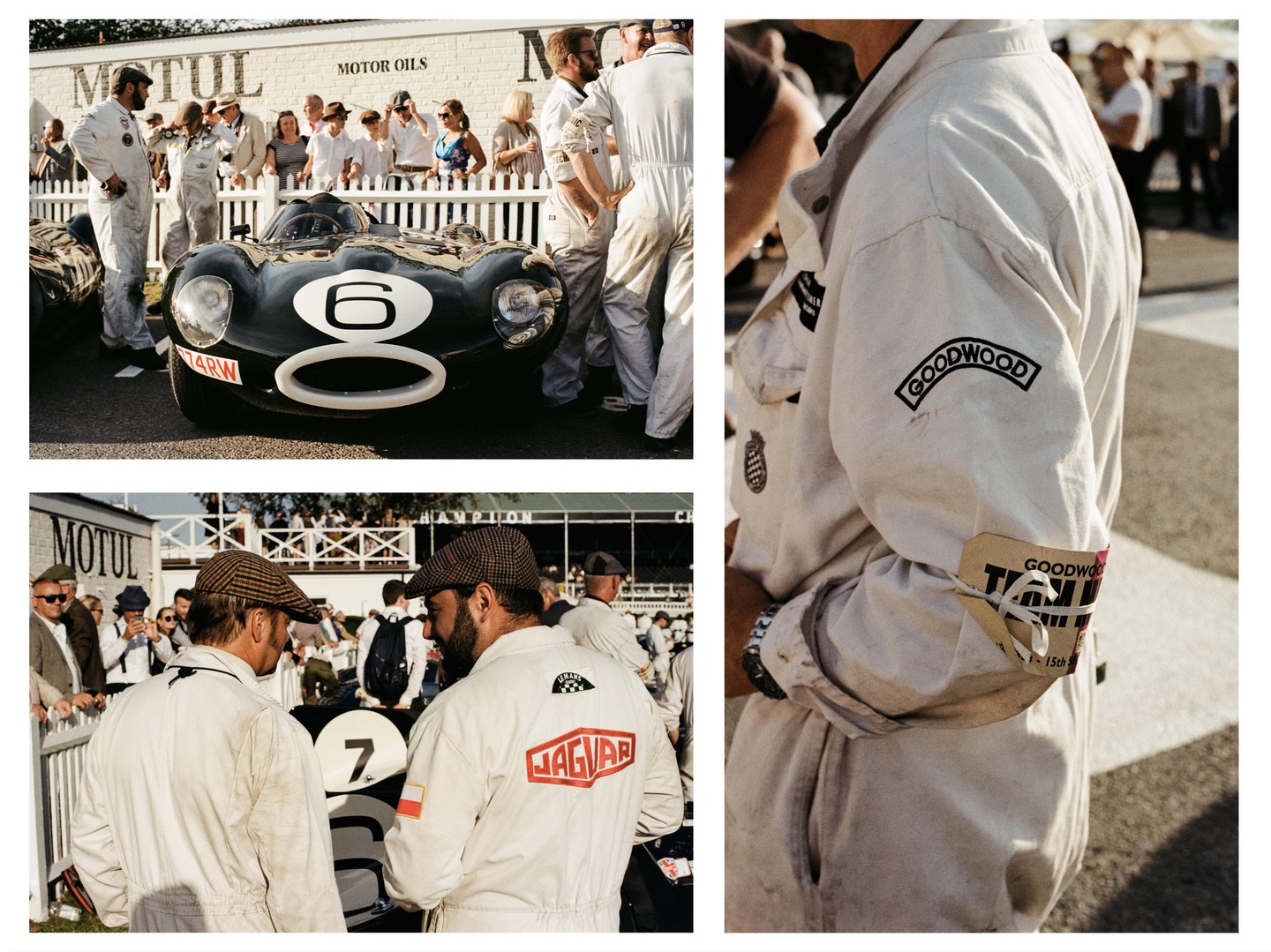 A black vintage race car with the number six is parked on asphalt surrounded by men in white jumpsuits and spectators.