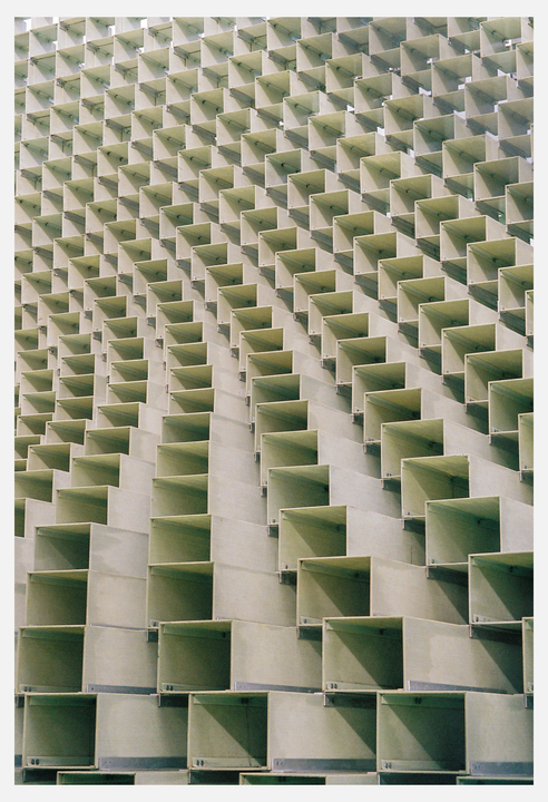 A wall of square, box-like structures creates a repeating pattern.