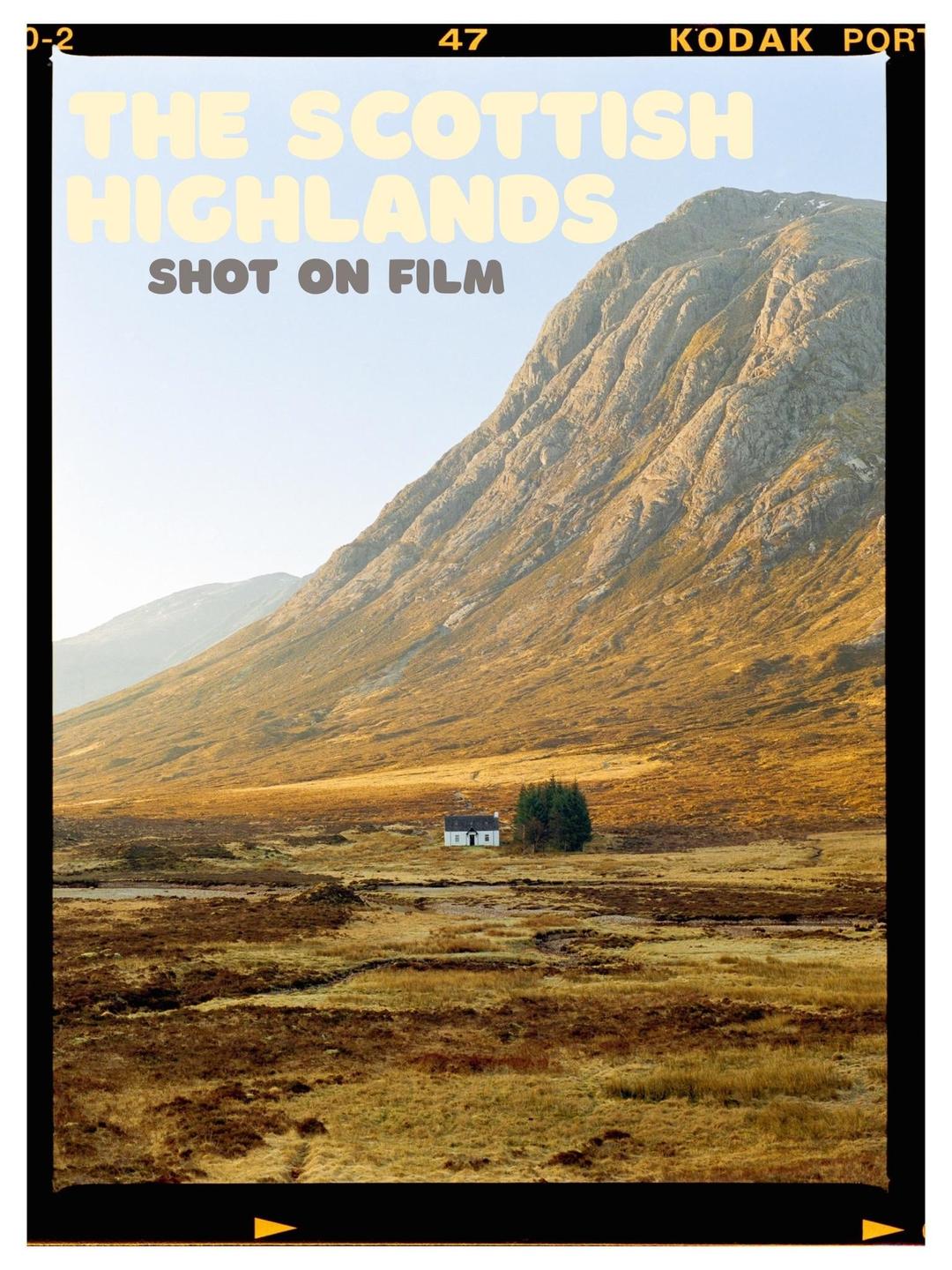 A small white house with a cluster of trees sits in a vast, golden-brown field at the base of a large mountain.