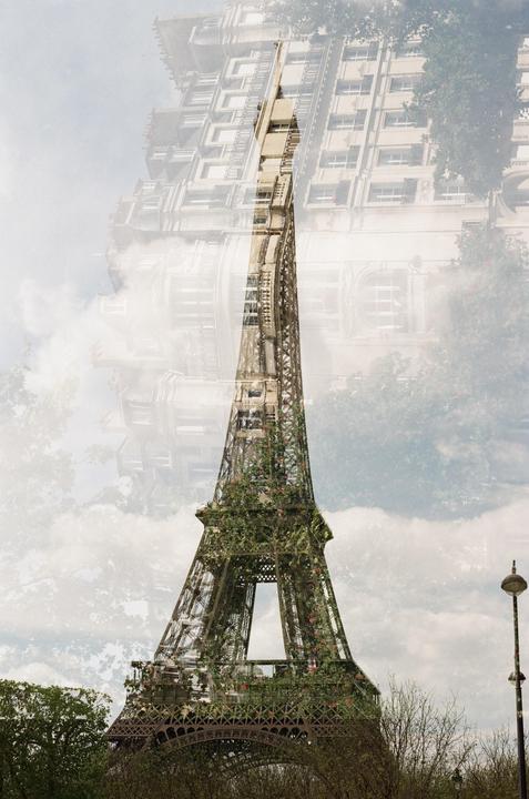 A double exposure shows the Eiffel Tower covered in foliage superimposed over a building facade.