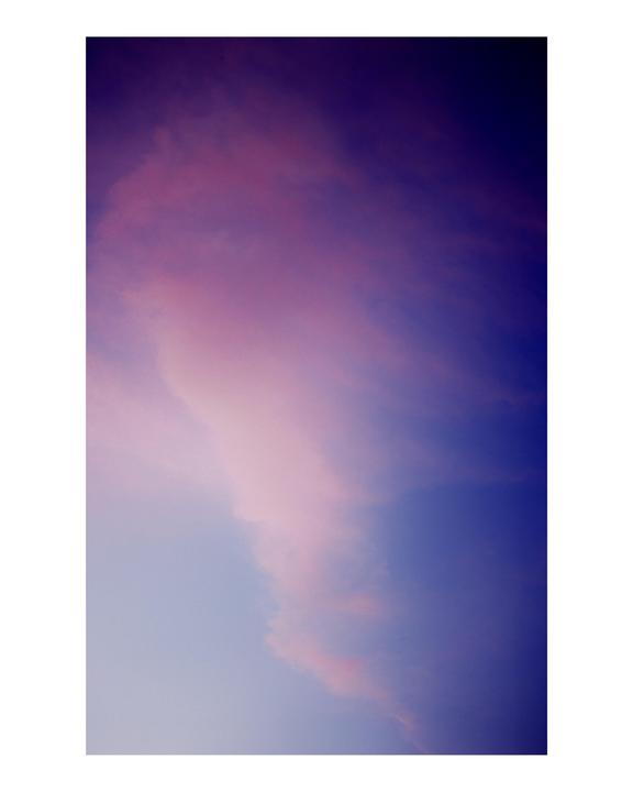Pink and purple cirrus clouds fill the sky.