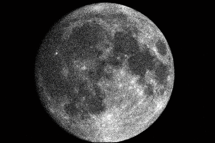 The full moon is visible in the night sky with a small bright spot on its surface.