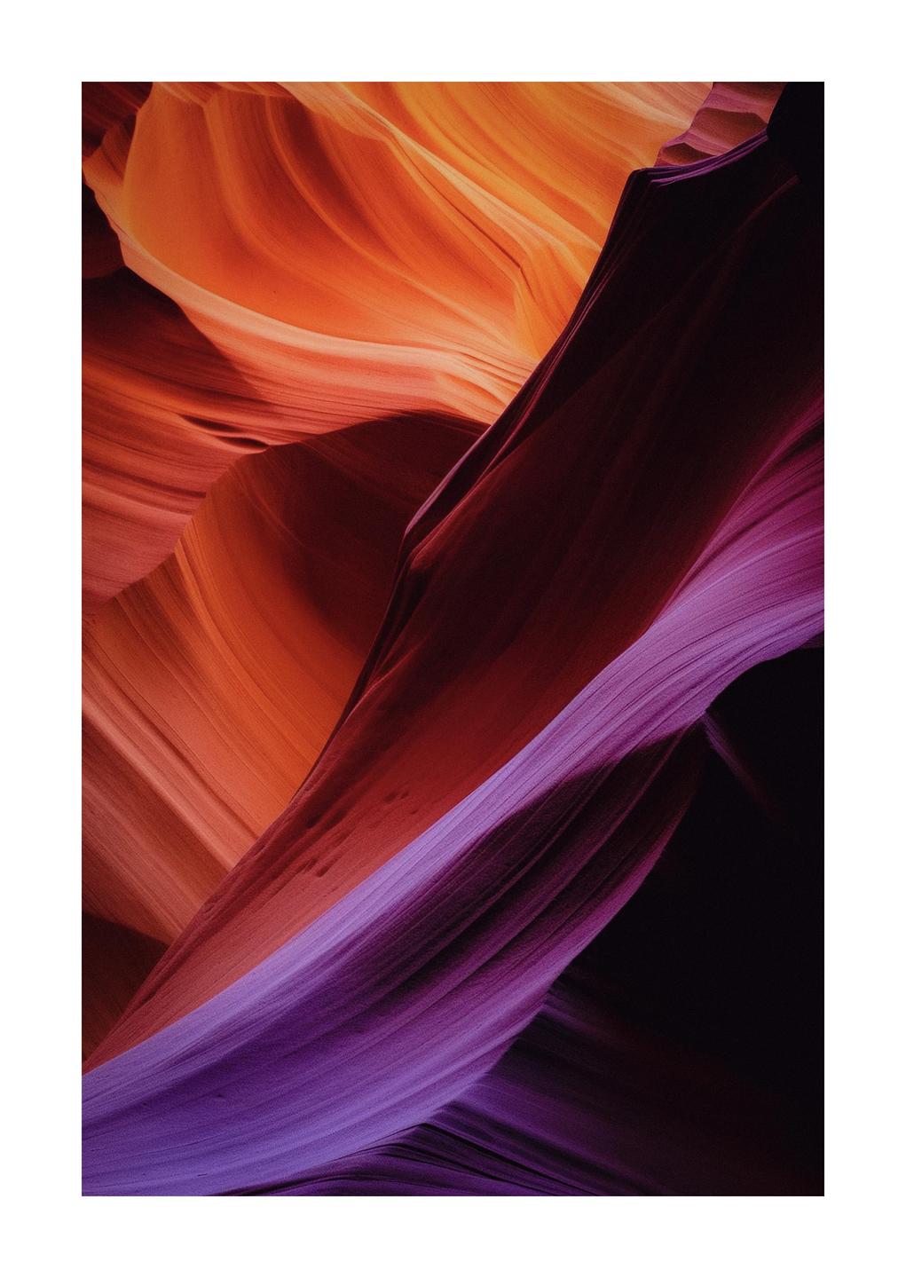 The smooth, wavy rock formations of a canyon are illuminated by light from above, creating a gradient of color from orange to purple.
