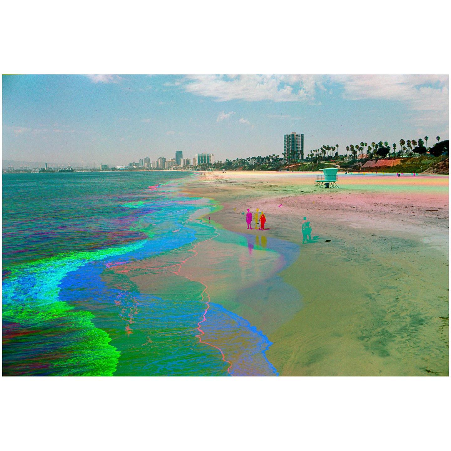 A beach with colorful waves and a city skyline in the distance is visible under a blue sky.