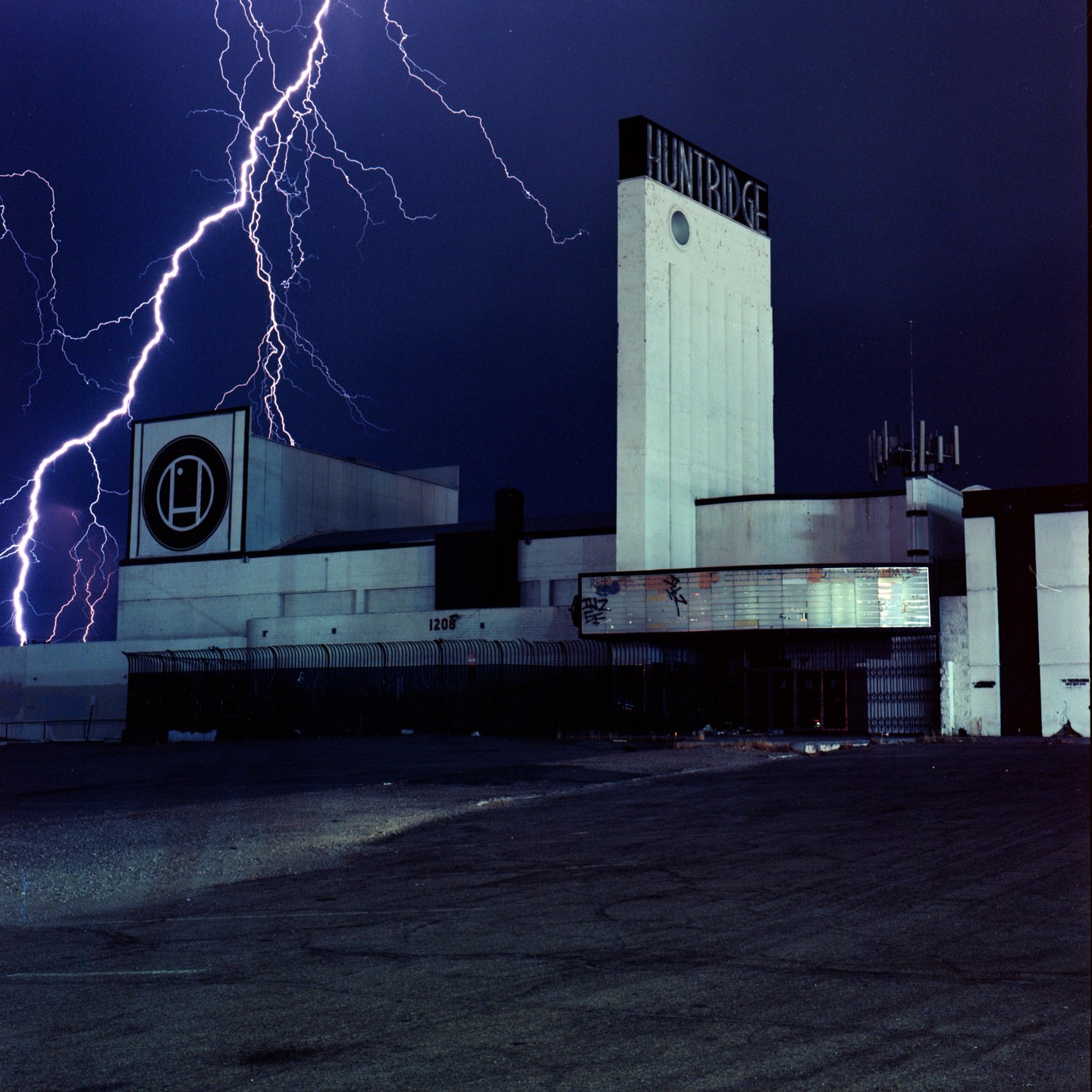 A lightning bolt strikes above the Huntridge building at night.
