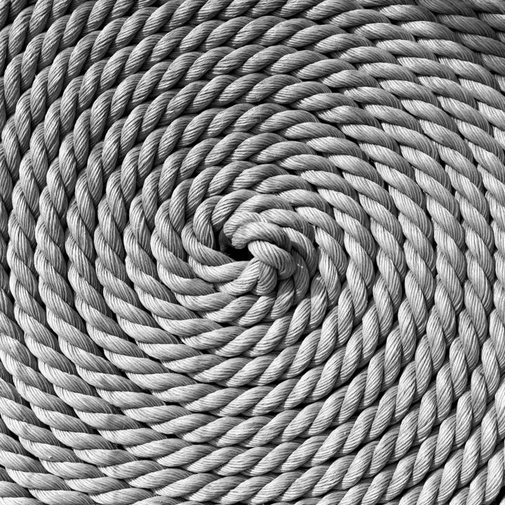 A coiled rope forms a spiral pattern.