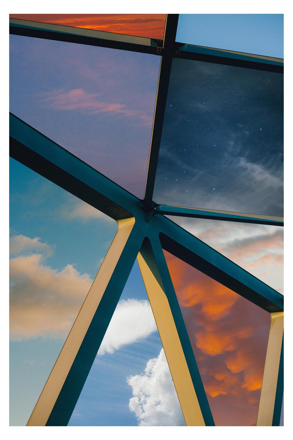 A geometric structure frames different sections of the sky, including clouds at various times of day and a starry night sky.