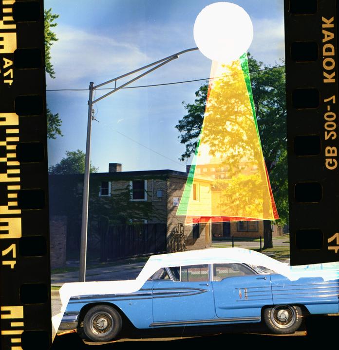 A blue vintage car is parked on a street with a building and trees in the background, overlaid with a white circle and colored triangles.
