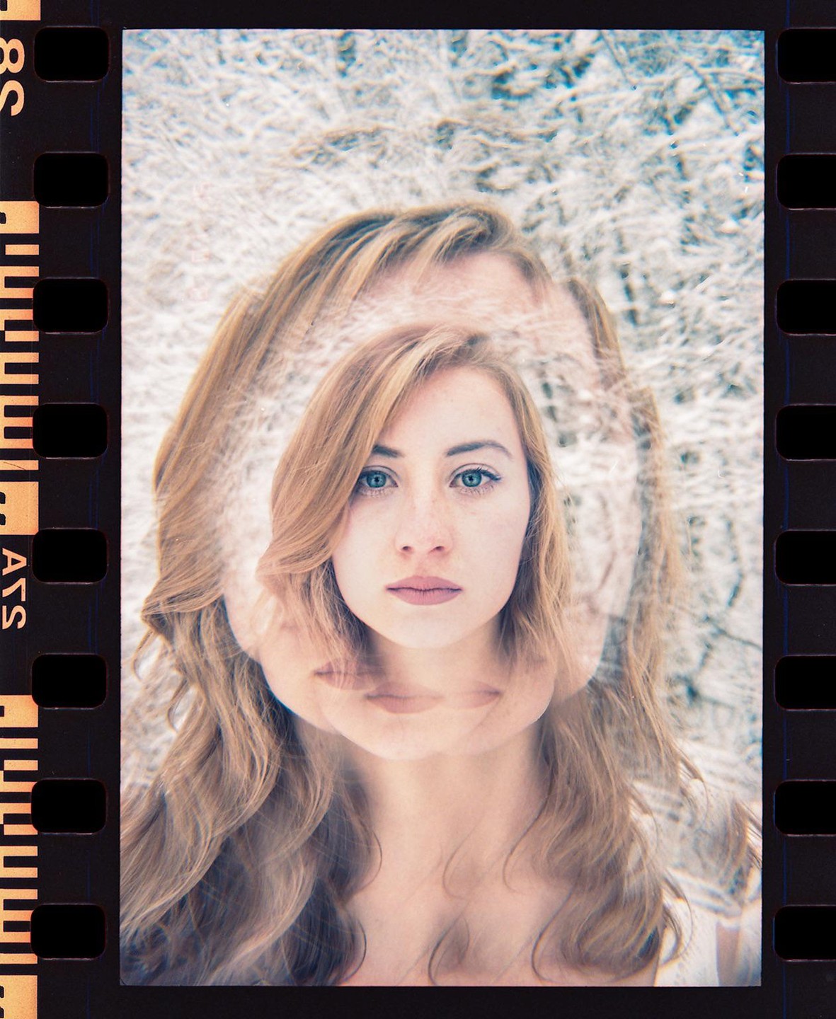 A woman with long hair is shown in a multiple exposure portrait with a snowy background.