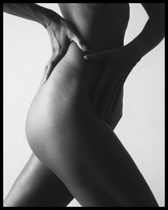 A woman's torso, hip, and legs are visible in a self-portrait.