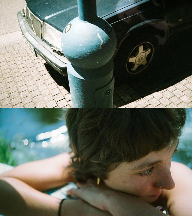 A diptych shows a blue pole and a car on a cobblestone street in the top frame, and a woman with a nose ring and earring resting her head on her arms in the bottom frame.