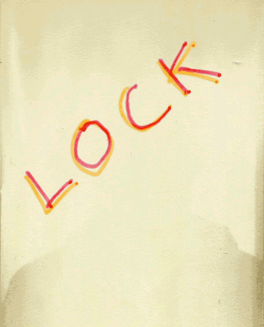 The word "LOCK" is written in red and orange marker on a light-colored surface.