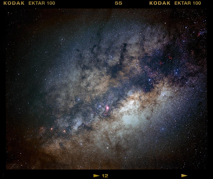 The galactic center of the Milky Way is visible with many stars and nebulae.