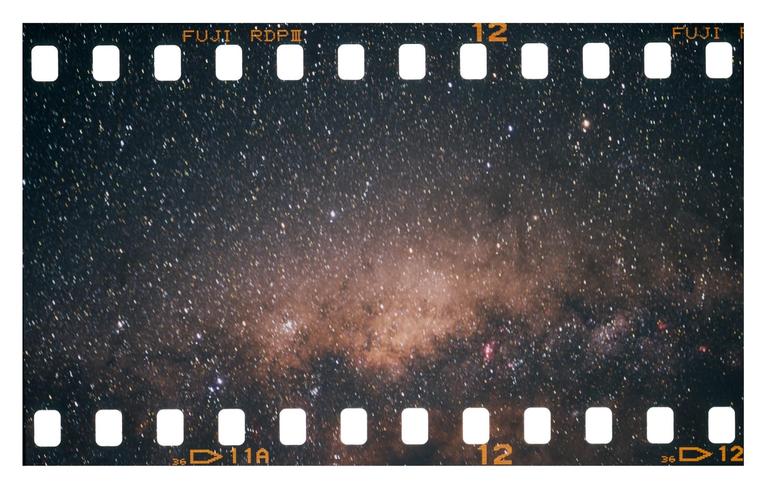 A long exposure captures the milky way on a strip of 35mm film.