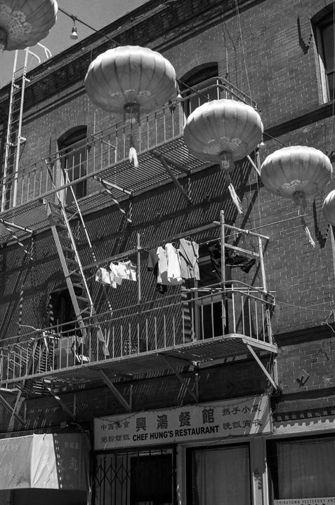 Laundry hangs on a fire escape above a restaurant in Chinatown.
