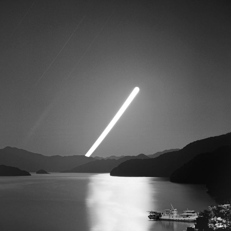 A bright light source illuminates a body of water surrounded by mountains, with a boat docked in the foreground.