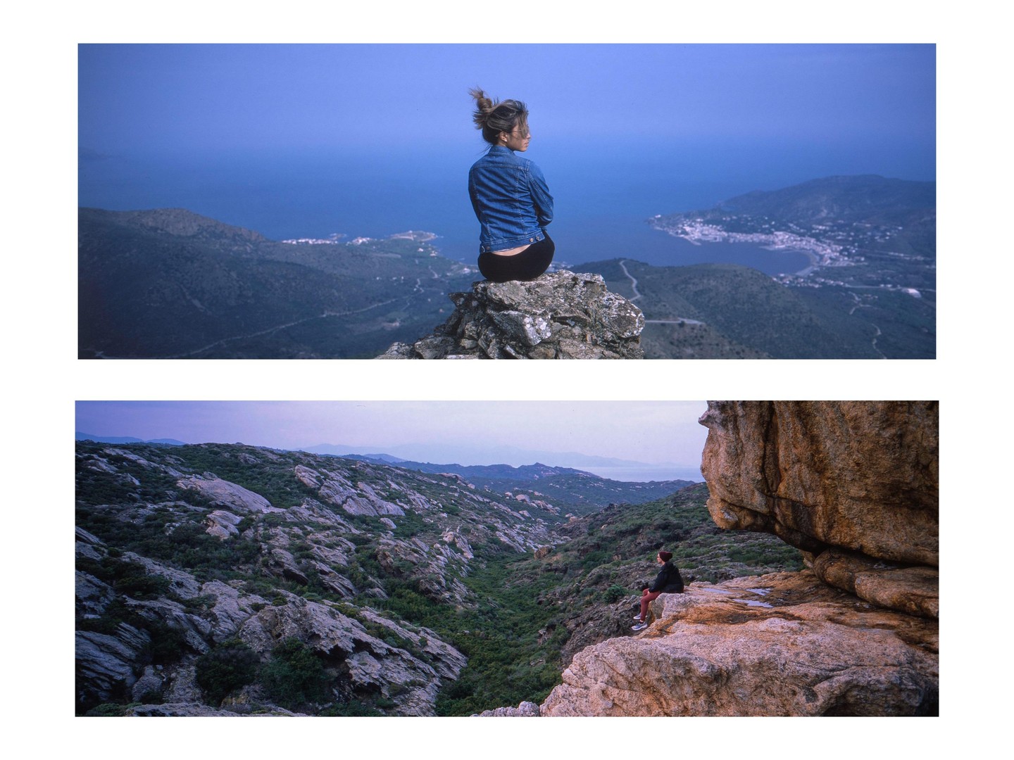 A woman sits on a rocky outcrop overlooking a coastal town and the sea, while another person sits on a large rock in a rugged, green valley.